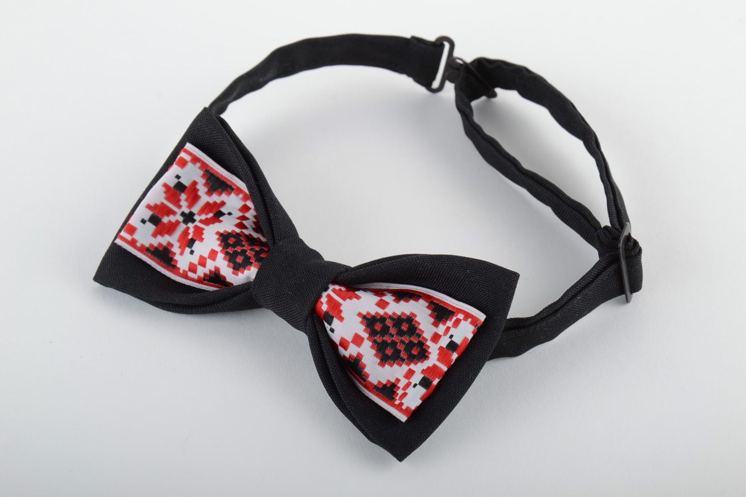 Handmade bow tie sewn of black and ornamented costume fabric in ethnic style photo 2