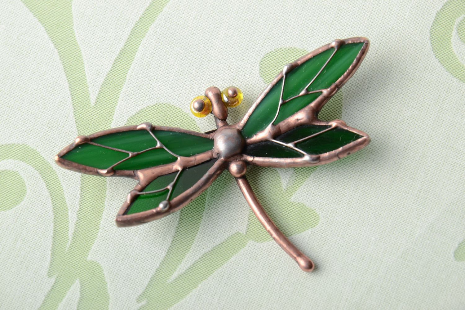 Stained glass brooch in the shape of dark green dragonfly photo 1