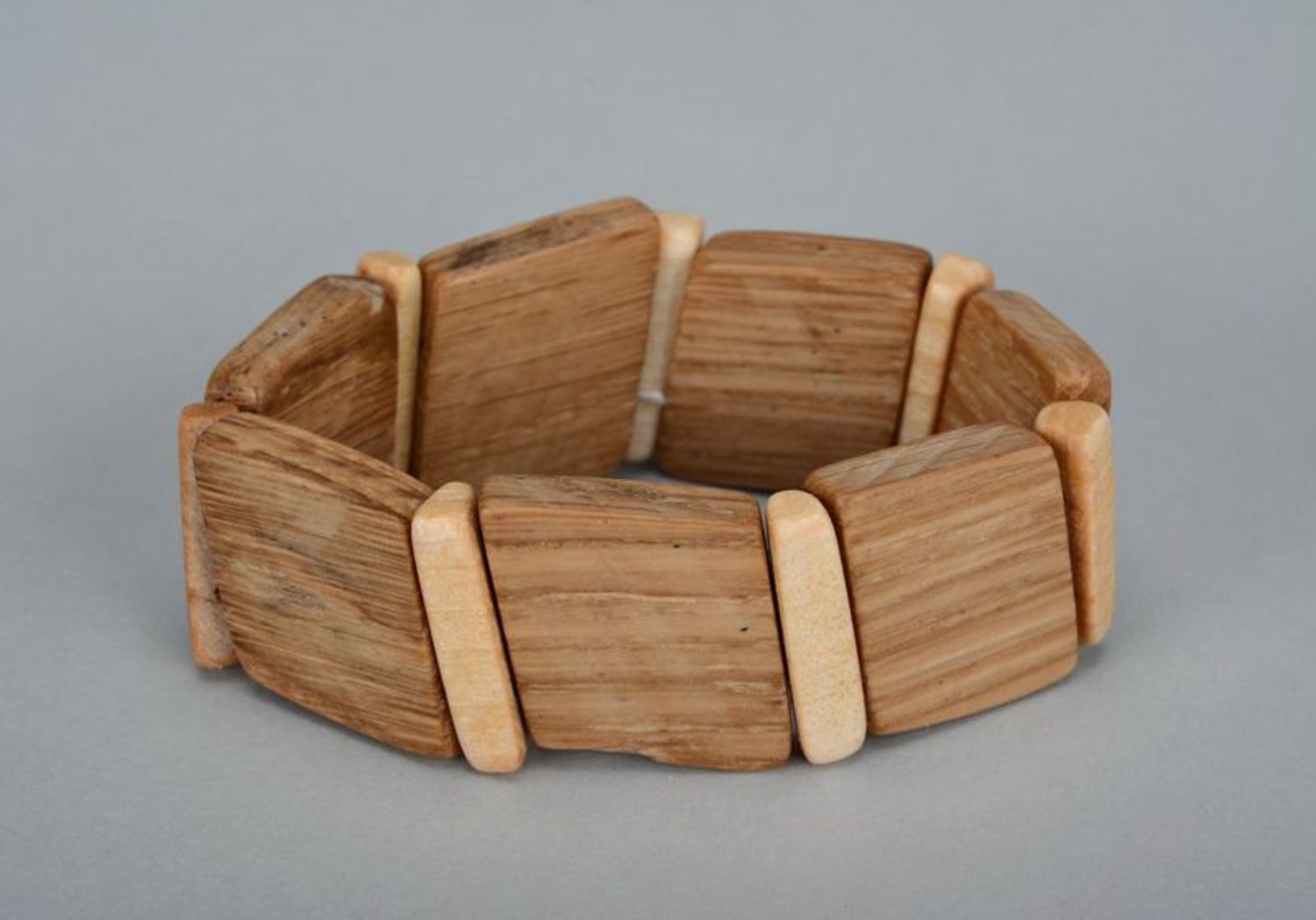 Brown wooden bracelet on elastic band photo 1