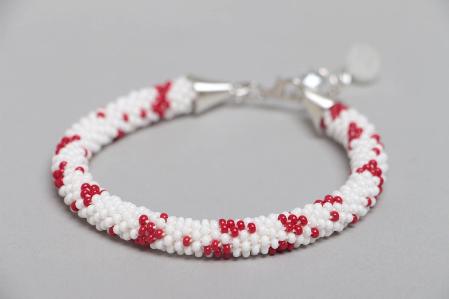 Handmade designer white and red beaded cord women's wrist bracelet with charms  photo 3