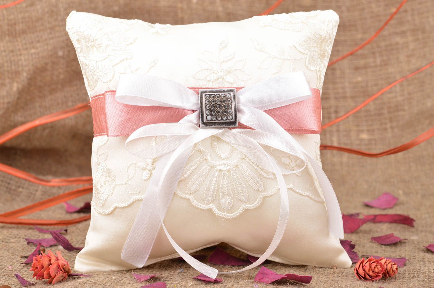 Homemade wedding ring pillow sewn of white satin with lace and pink ribbon photo 1