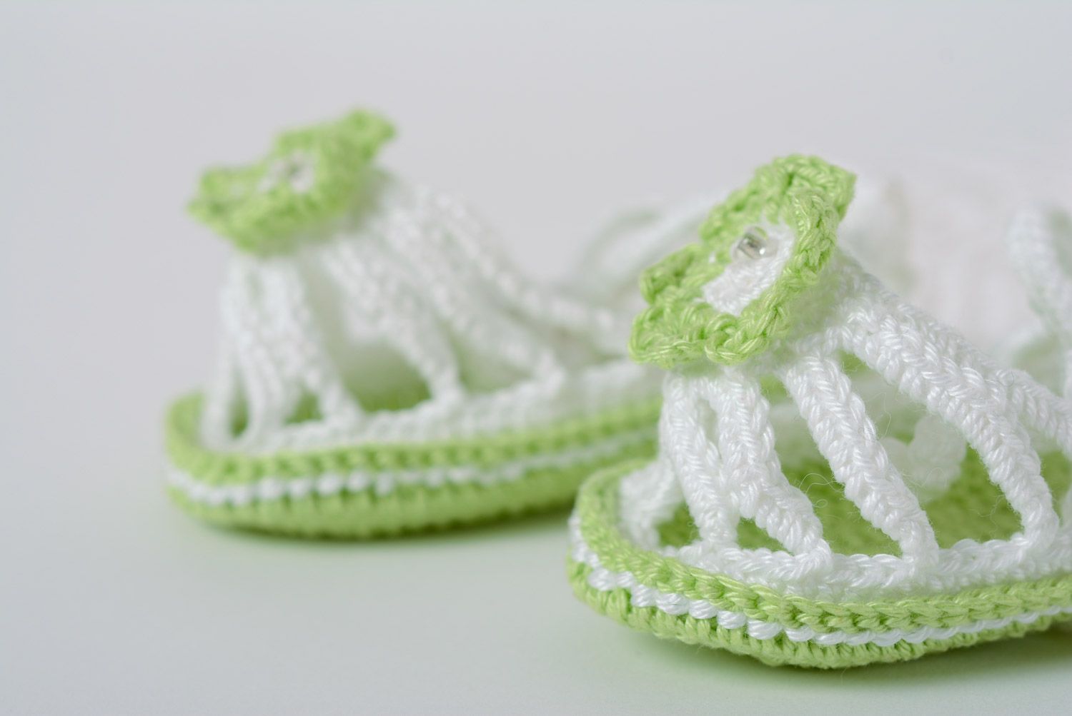 Handmade summer baby booties crocheted of white and green acrylic threads for girl photo 2