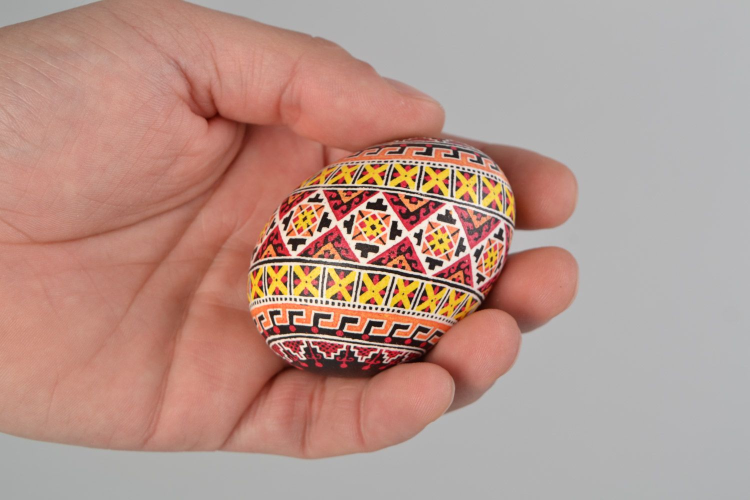 Handmade decorative Easter egg painted with wax Swastika photo 2