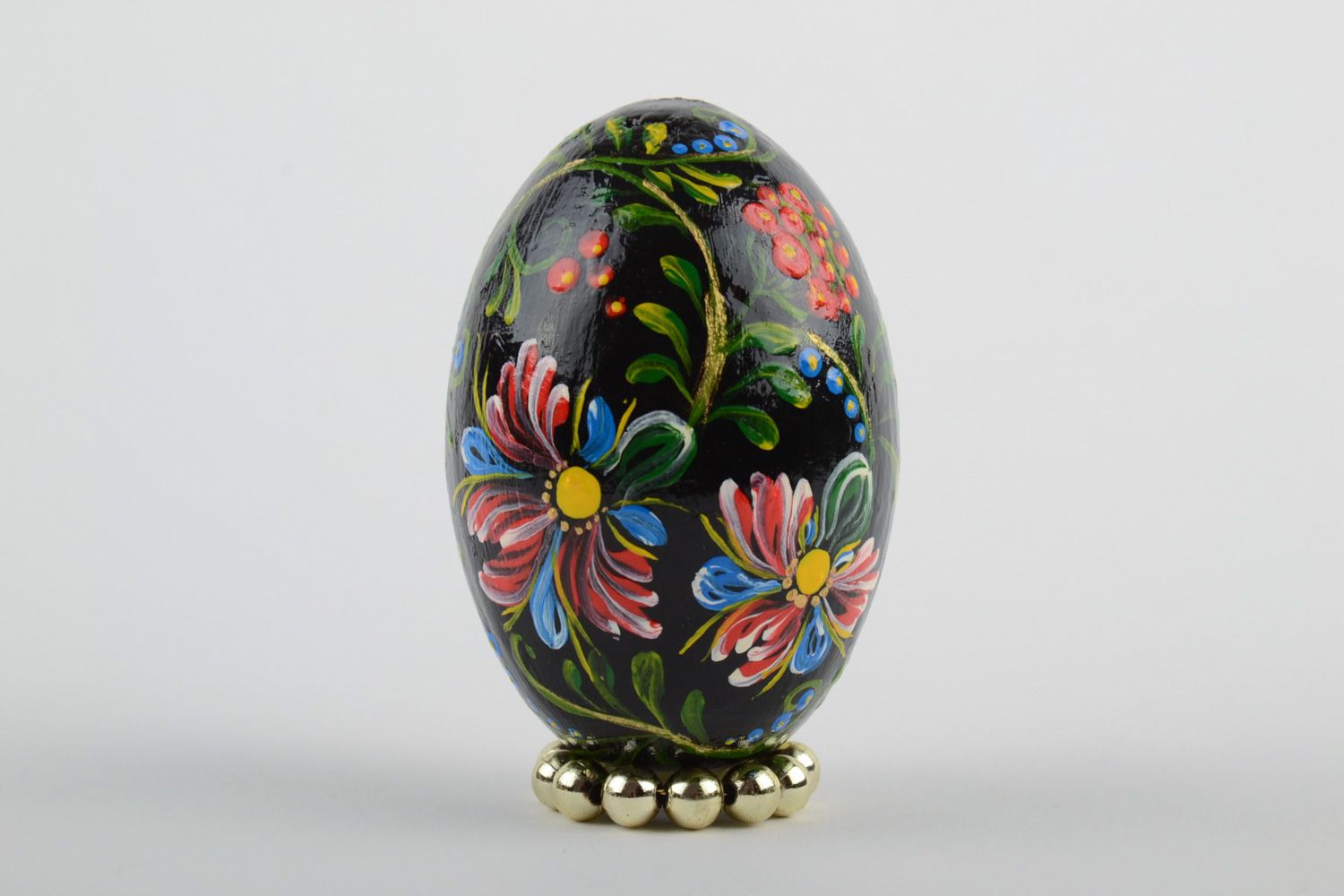 Handmade carved wooden Easter egg decorated using one stroke painting technique photo 2