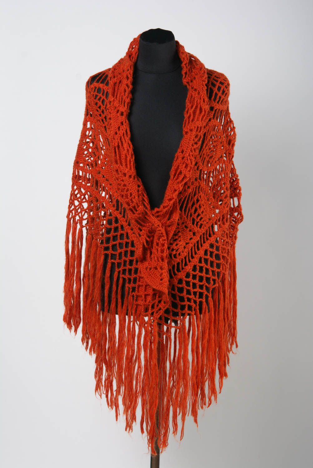 Handmade warm lace women's shawl knitted of wool of bright orange color photo 2
