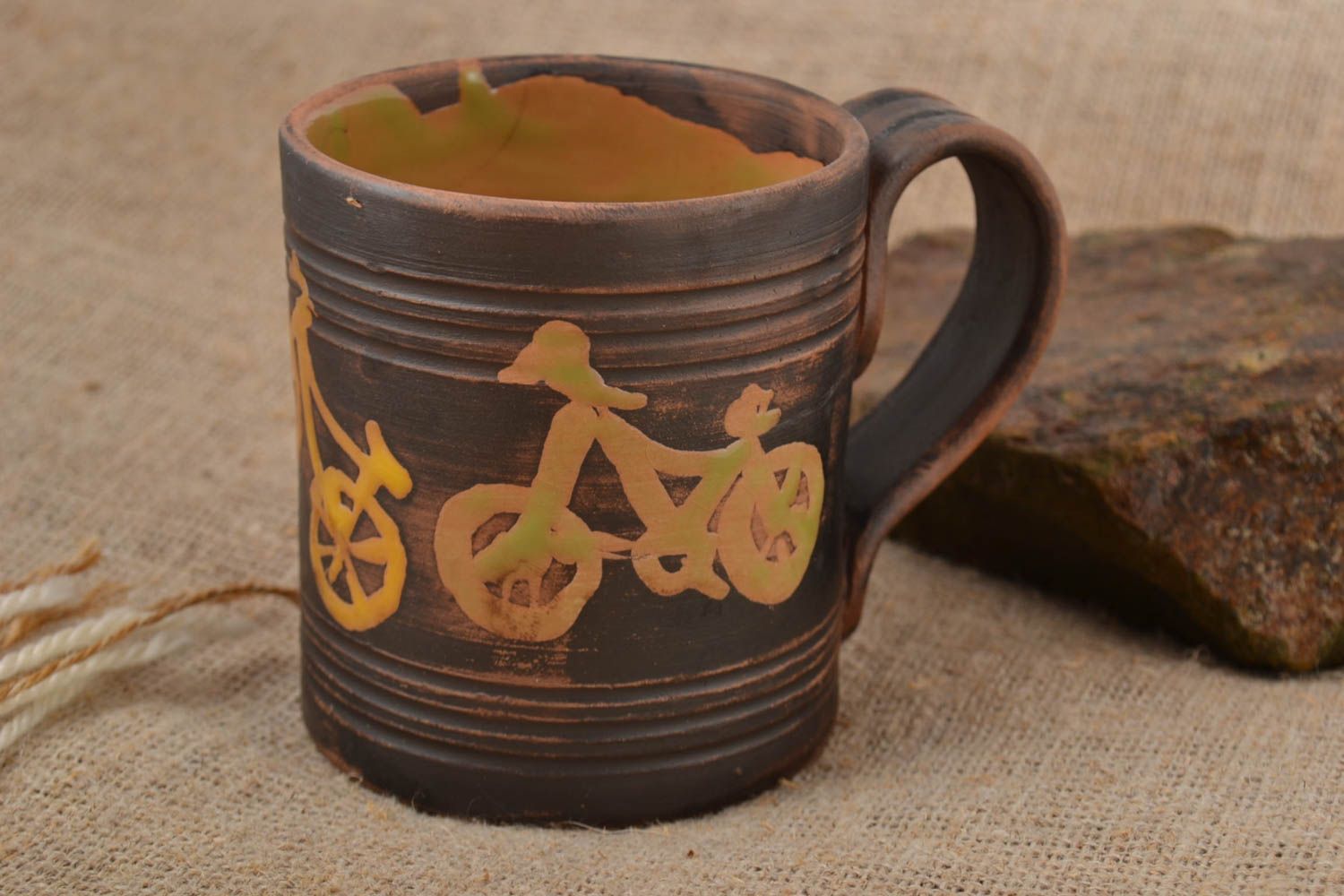 Handmade ceramic 8 oz coffee mug in dark brown and beige color with handle and bicycle pattern photo 1