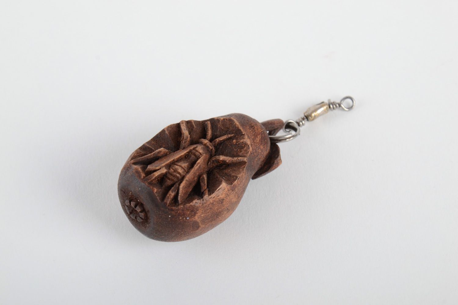 Small handmade decorative keychain carved of natural wood tinted and varnished  photo 2