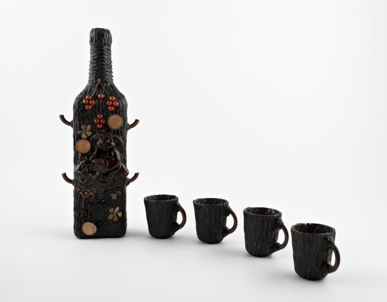 Decorative bottle with four cups photo 1
