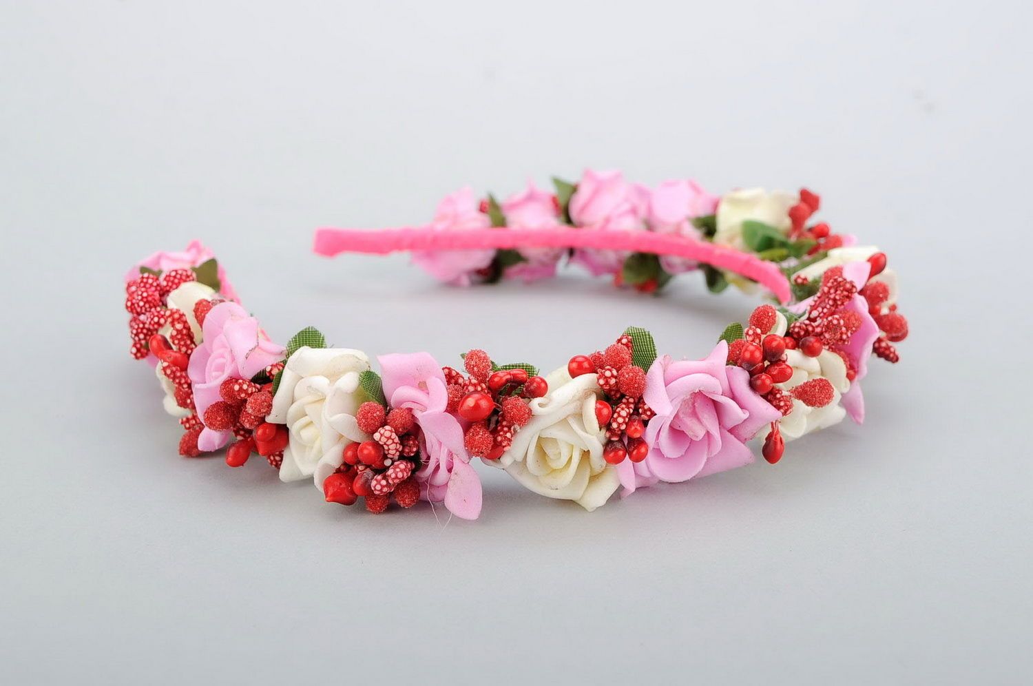 Headband with pink artificial flowers photo 1