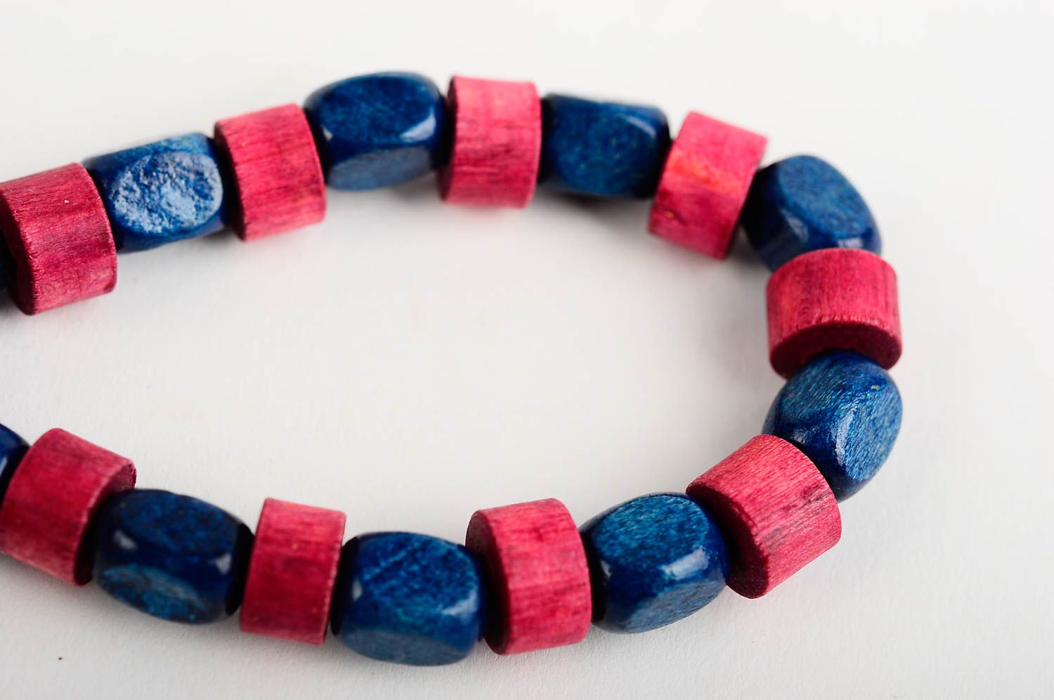 Stylish striped handmade beaded wooden bracelet wooden in red and blue color photo 5