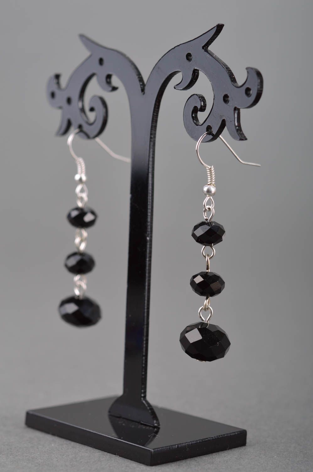 Long festive evening women's dangle earrings hand made of black faceted beads photo 3