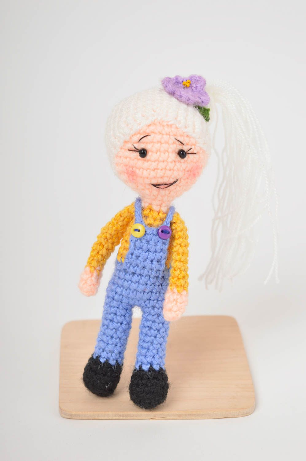 Knitted stuffed girl toy in blue jeans and pink sweater and blond hair. 4 inches tall photo 2