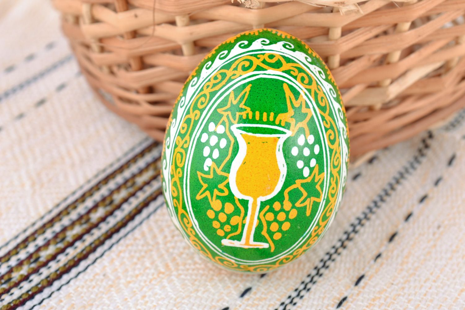 Yellow and green handmade bright painted Easter chicken egg with patterns photo 1