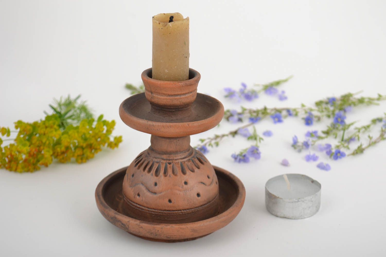 Handmade designer brown clay candlestick with patterns for one thin candle photo 1