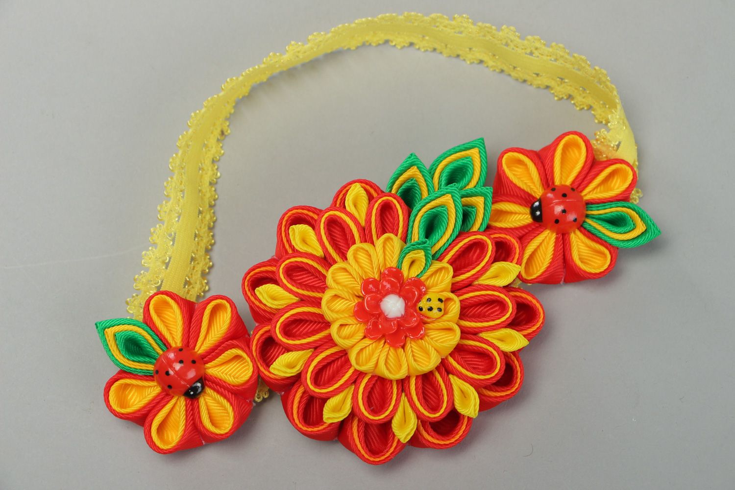 Bright handmade headband with kanzashi flowers in yellow red and green colors photo 1