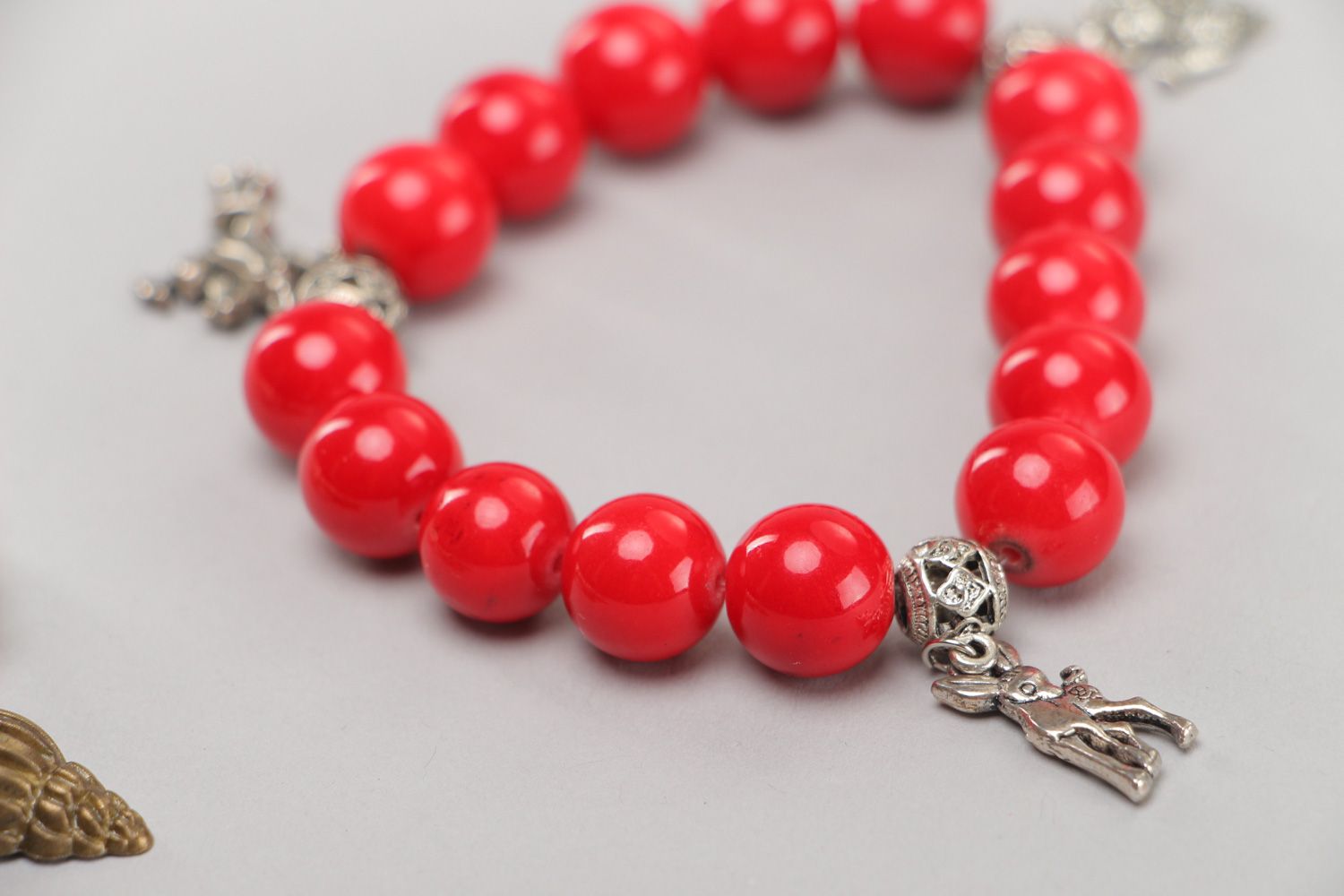 Designer handmade wrist bracelets with red beads and metal charms 2 items photo 4