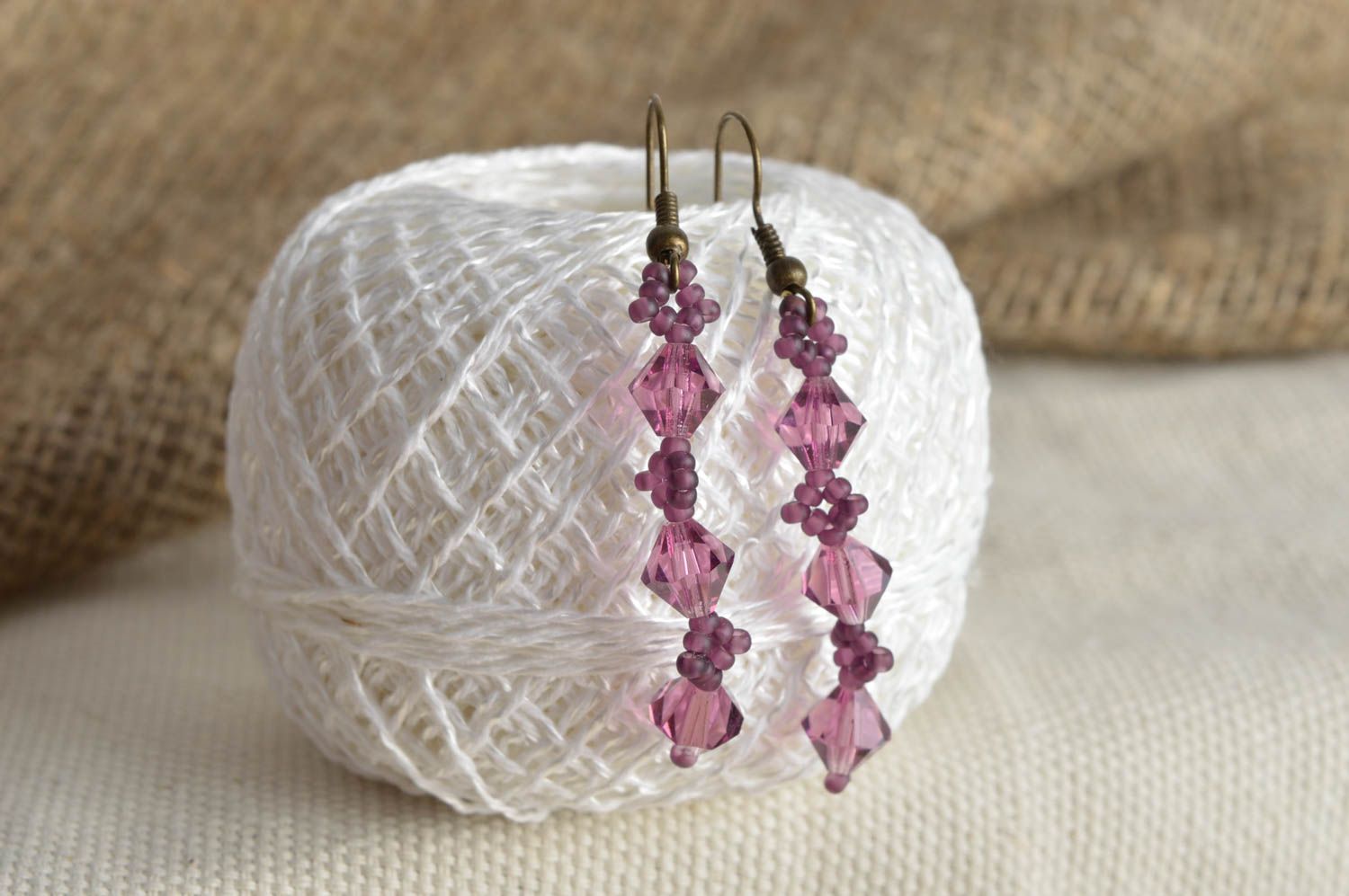 Handmade long dangle earrings of violet color with seed and plastic beads photo 1