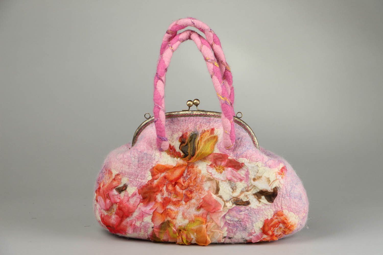 Bolsa de cor rosa feita de lã e seda foto 1