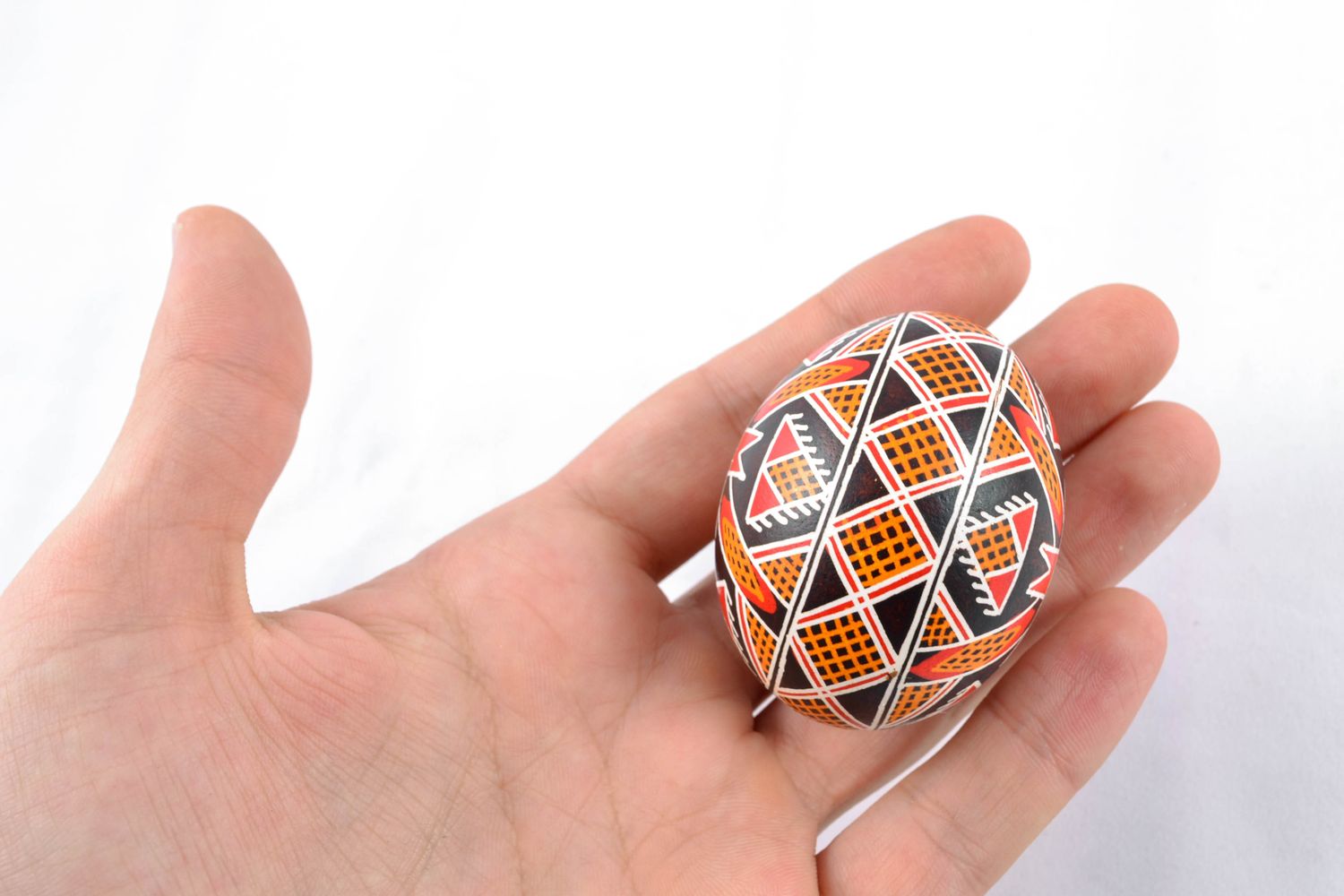 Handmade painted chicken egg with solar symbol photo 2