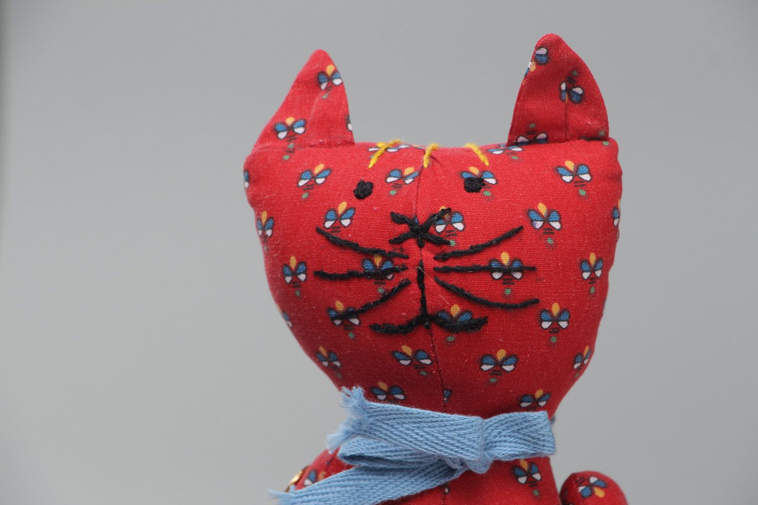 Beautiful homemade soft toy sewn of red fabric with floral pattern Cat with bow photo 3