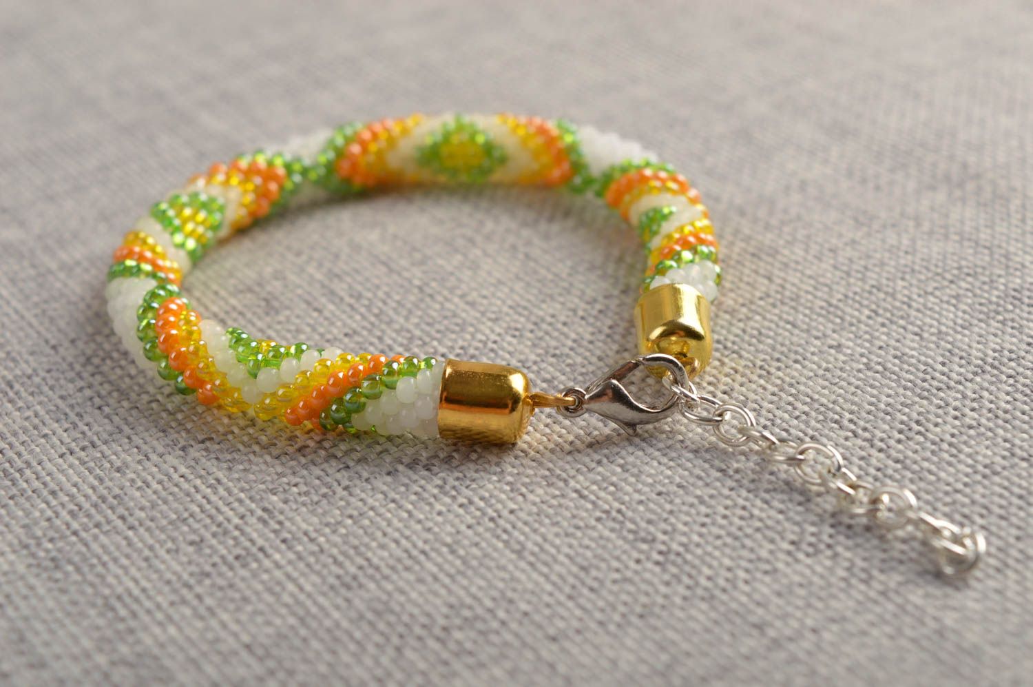 Beaded cord adjustable bracelet in light green, yellow and white color photo 1