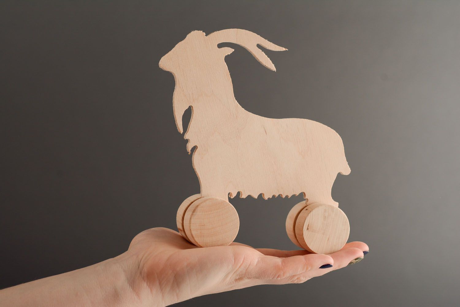 Wooden toy with wheels Goat photo 3
