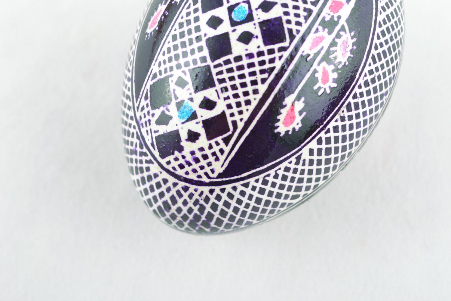 Blue and white handmade Easter egg painted with wax photo 4