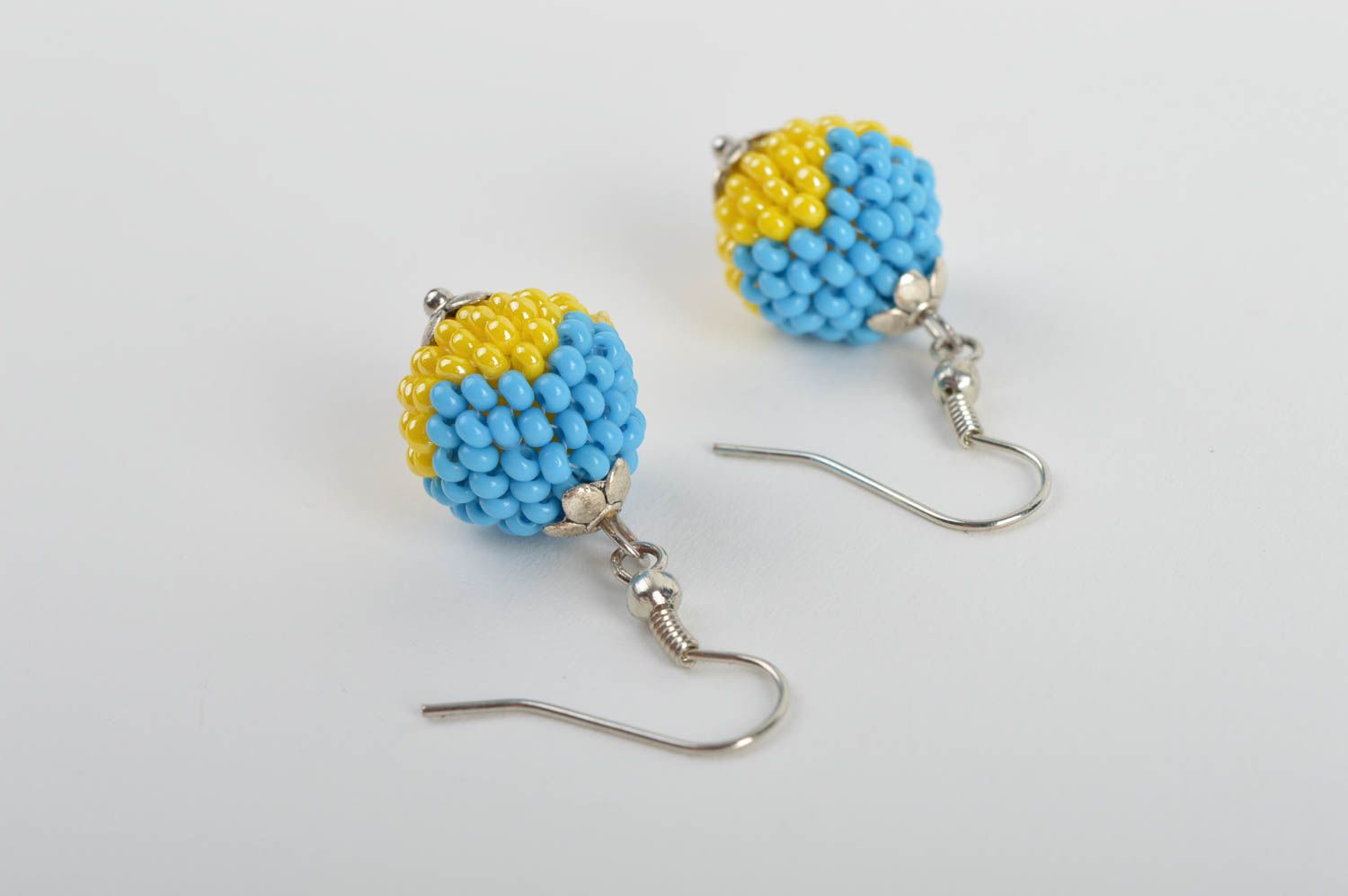 Handmade ball shaped dangle earrings woven of blue and yellow Czech beads photo 5