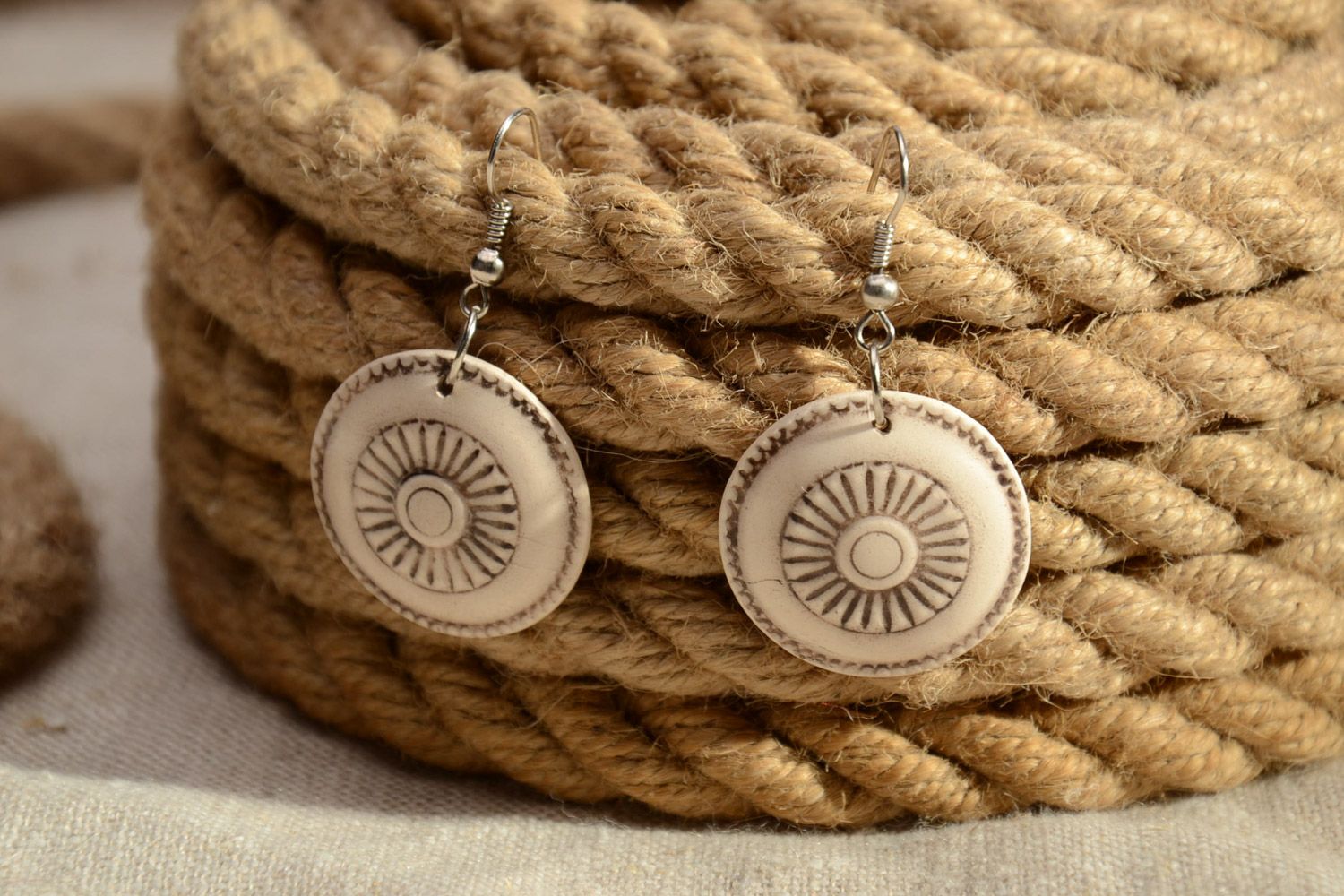 Small handmade beige round ceramic earrings in ethnic style for women photo 1