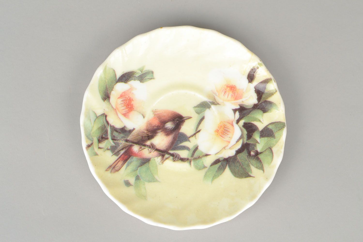 Wall ceramic plate with a bird photo 1