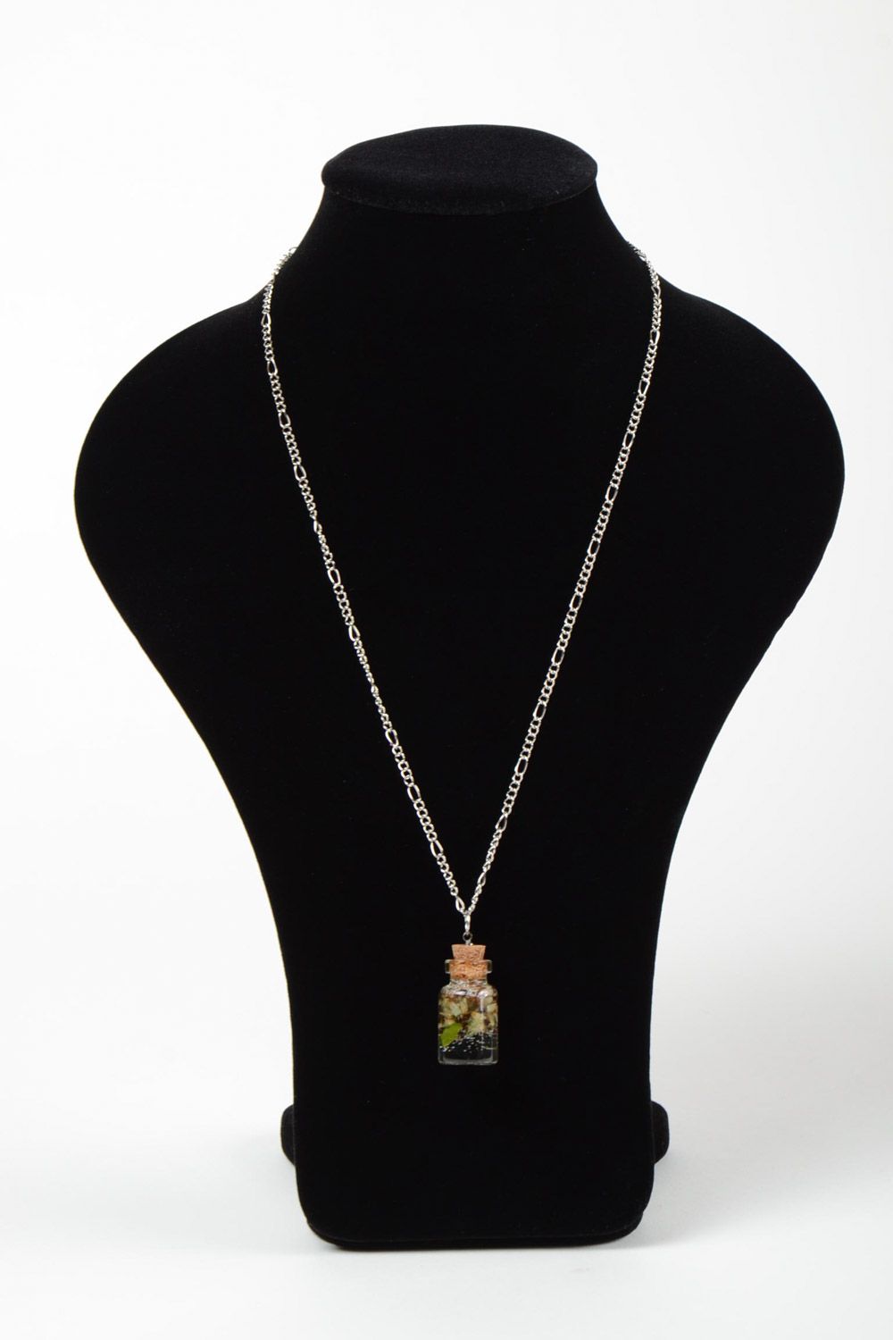 Handmade neck pendant with real flowers coated with epoxy in the shape of transparent vial photo 2