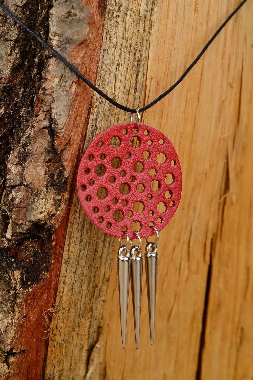 Pendant made of natural leather with studs photo 3