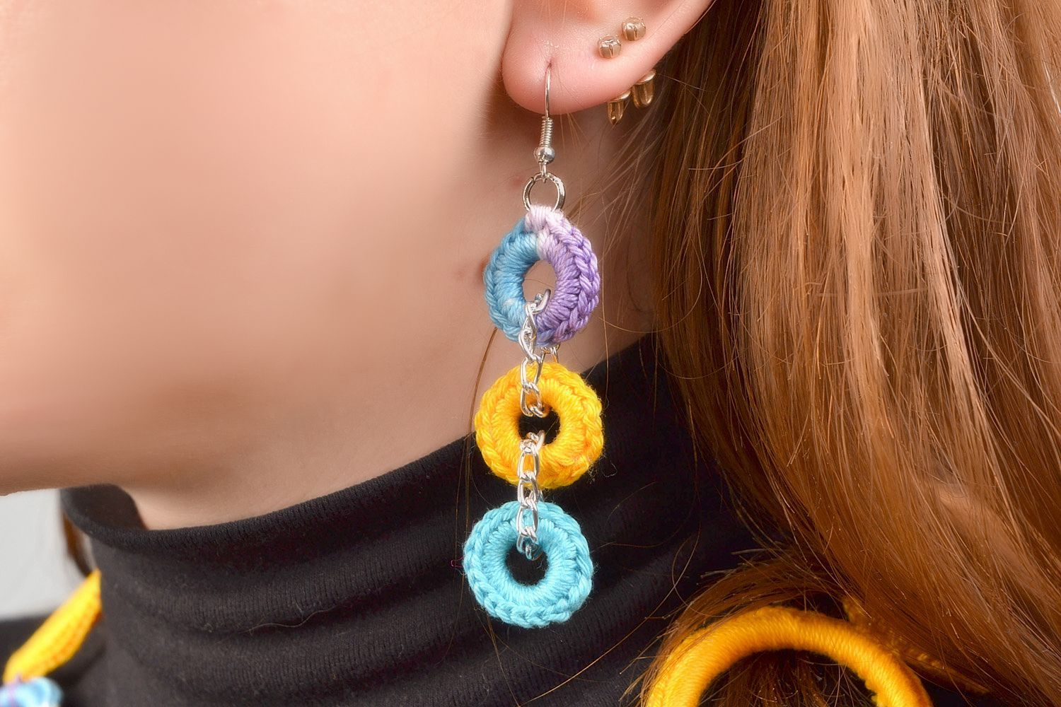 Handmade beautiful long round earrings woven of multicolored threads present for girl photo 1