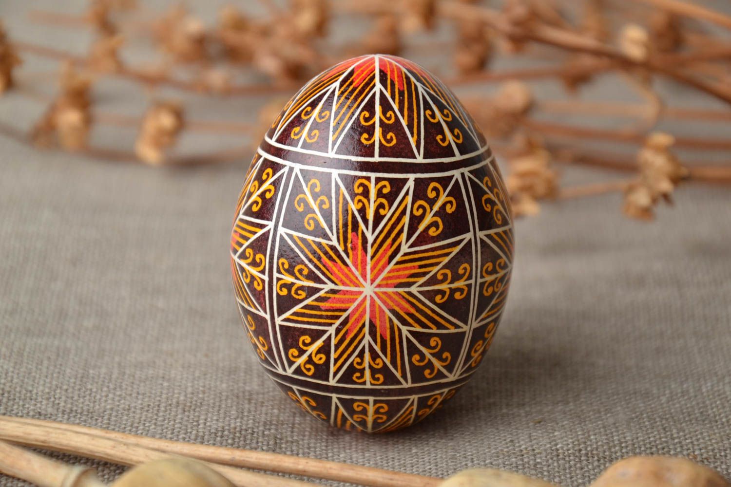 Handmade decorative Easter egg painted using waxing technique photo 1