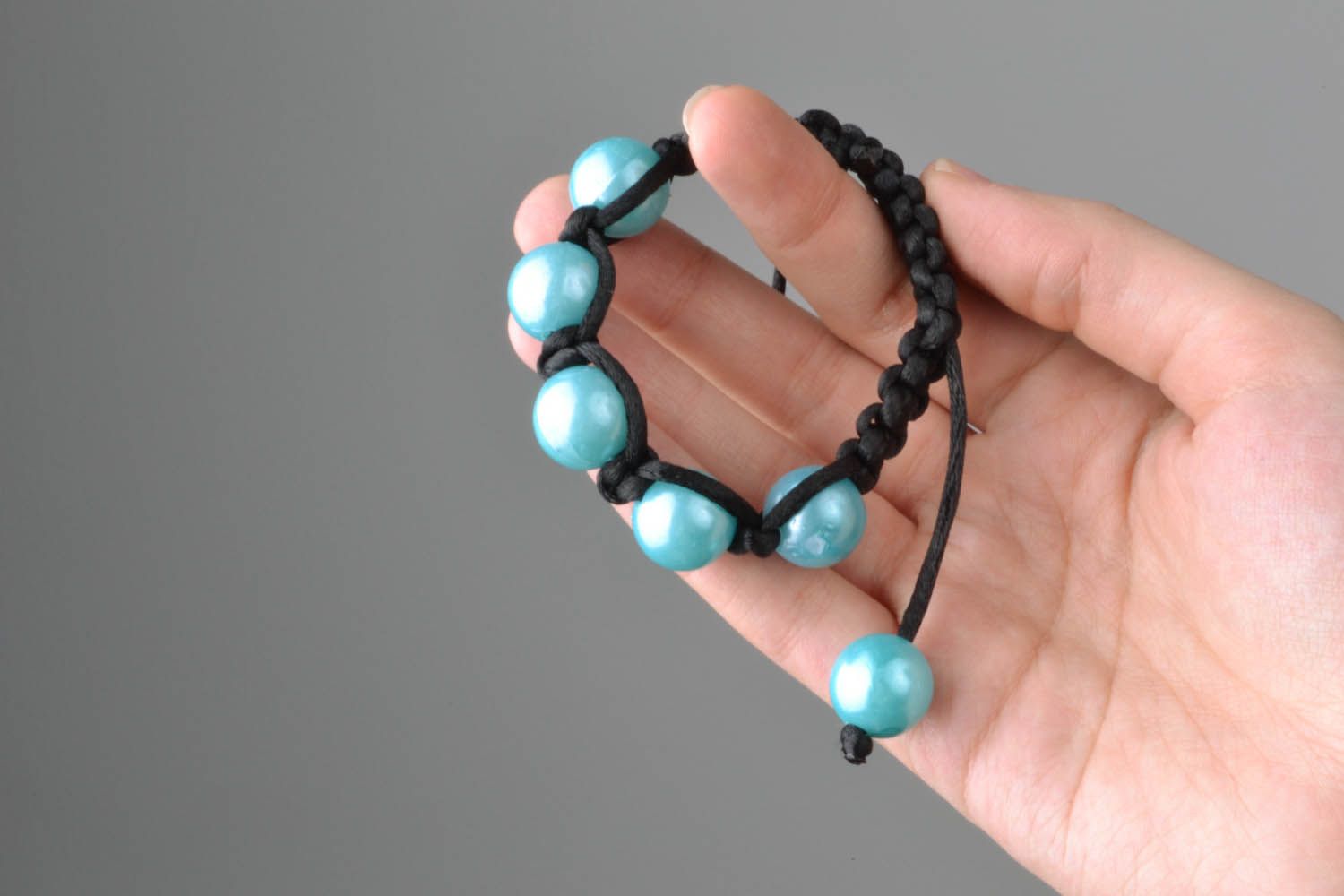 Braided bracelet with blue beads photo 4