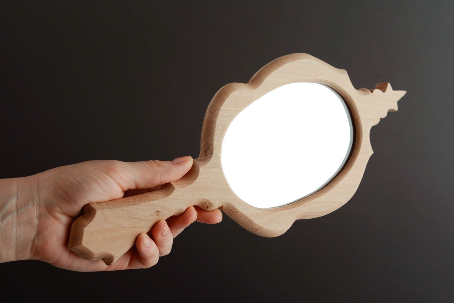 Hand mirror in wooden frame photo 1