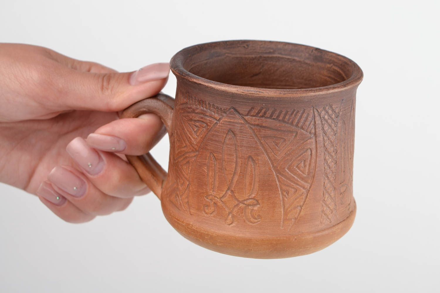 Non-glazed clay cup for tea or coffee with handle and Ukrainian country symbol photo 2