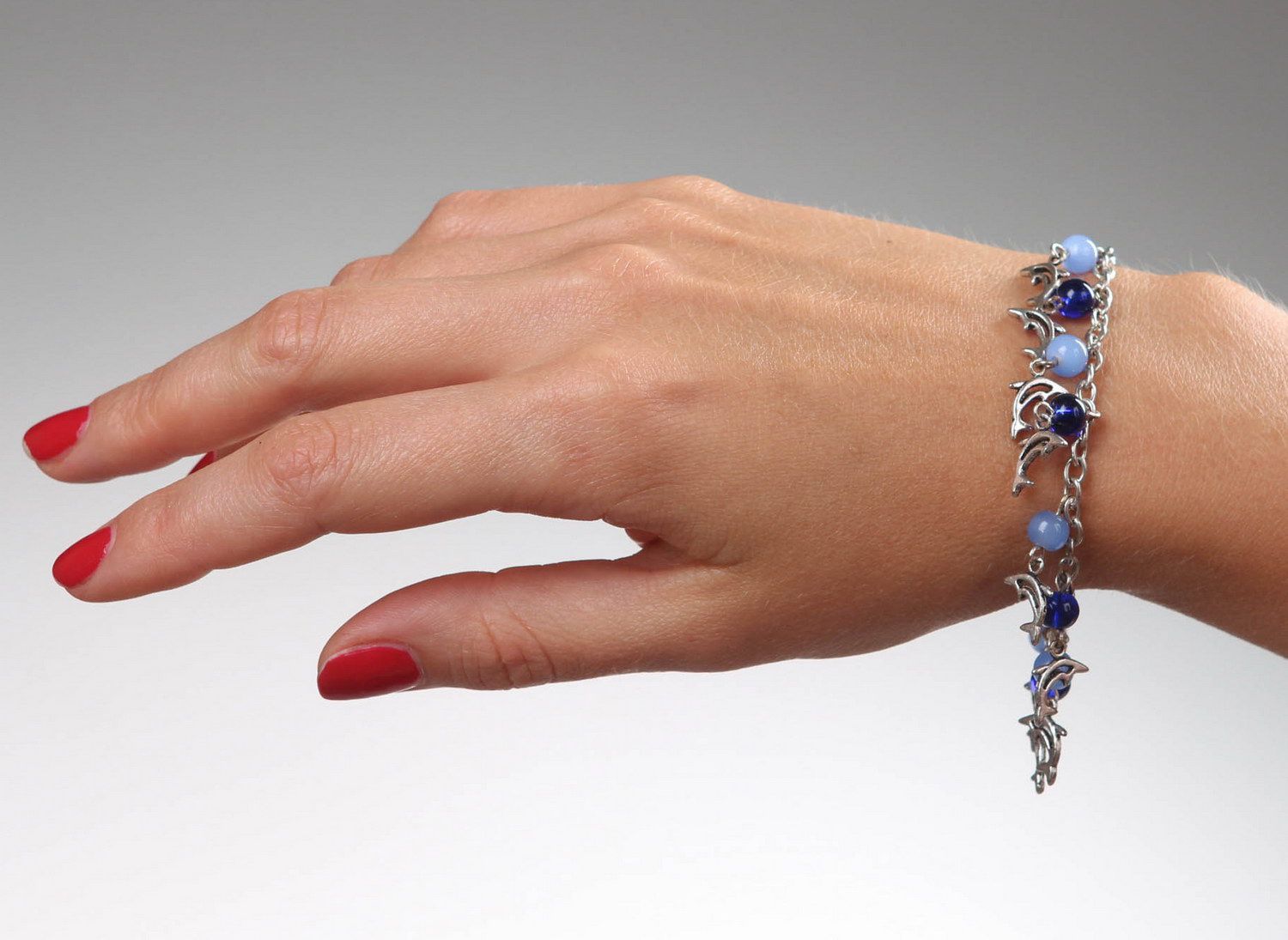 Bracelet avec pendentifs en verre et acier Dauphins  photo 4