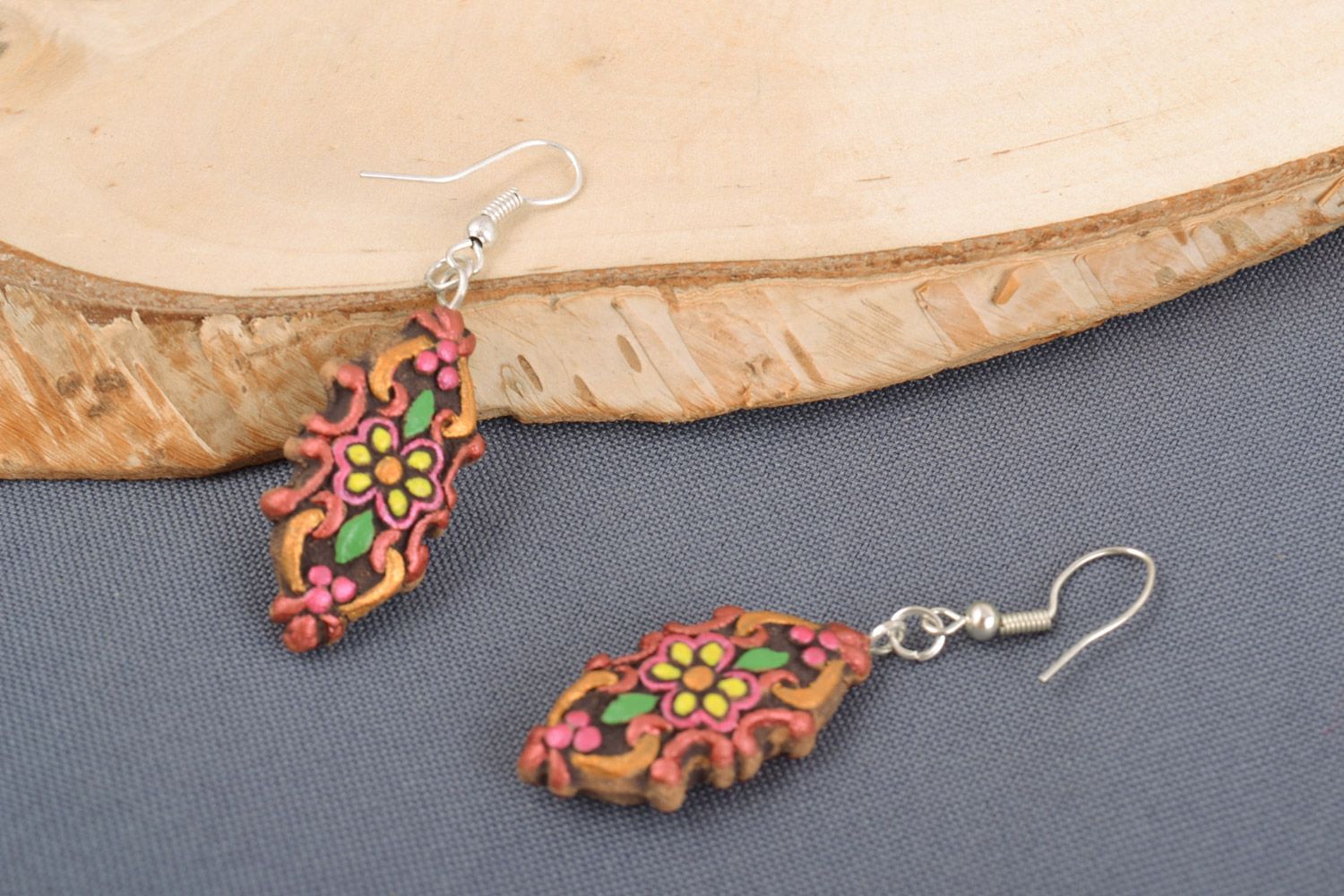Handmade ceramic dangling earrings of unusual shape painted with acrylics photo 1