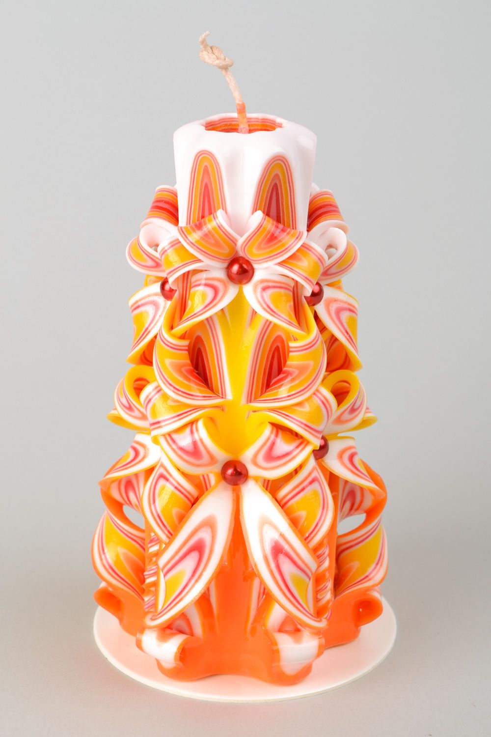 Colorful large carved candle photo 1
