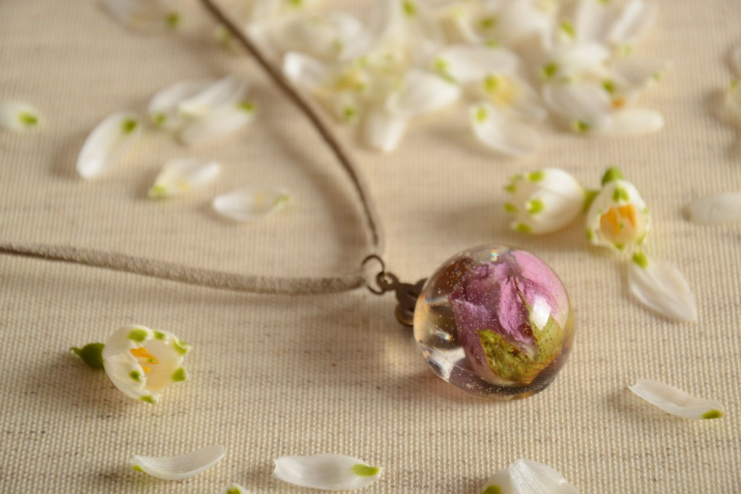 Handmade ball-shaped pendant with lilac flower in epoxy resin on suede cord  photo 1
