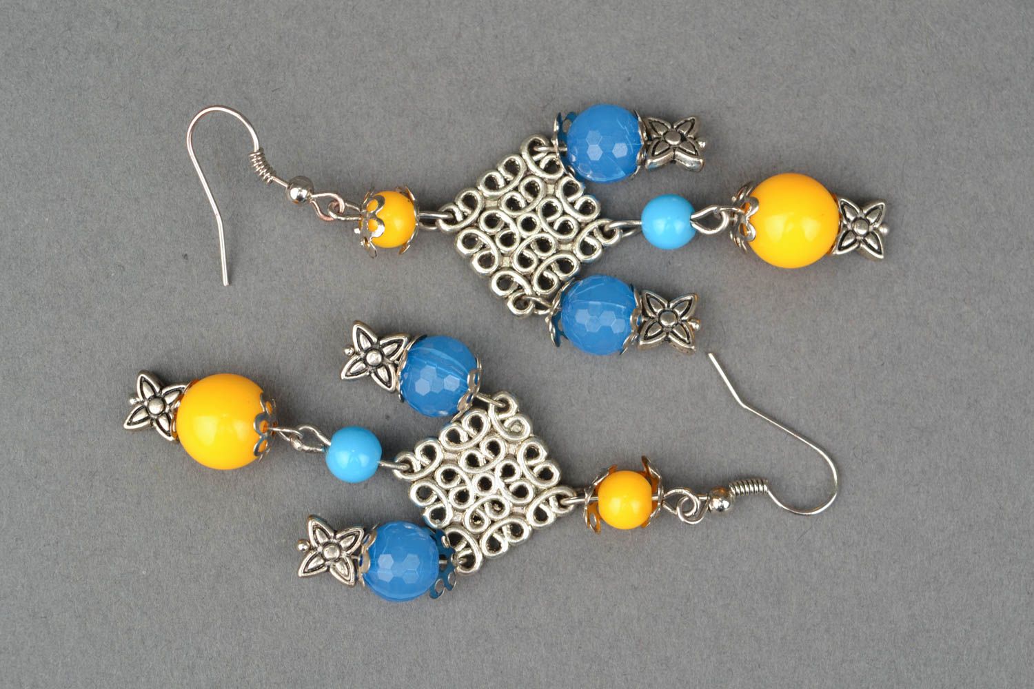Massive metal earrings with beads photo 3