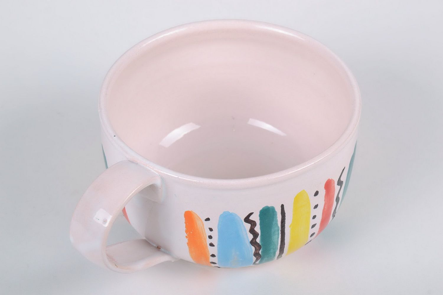 White glazed ceramic cup with handle in a color stripe pattern photo 4