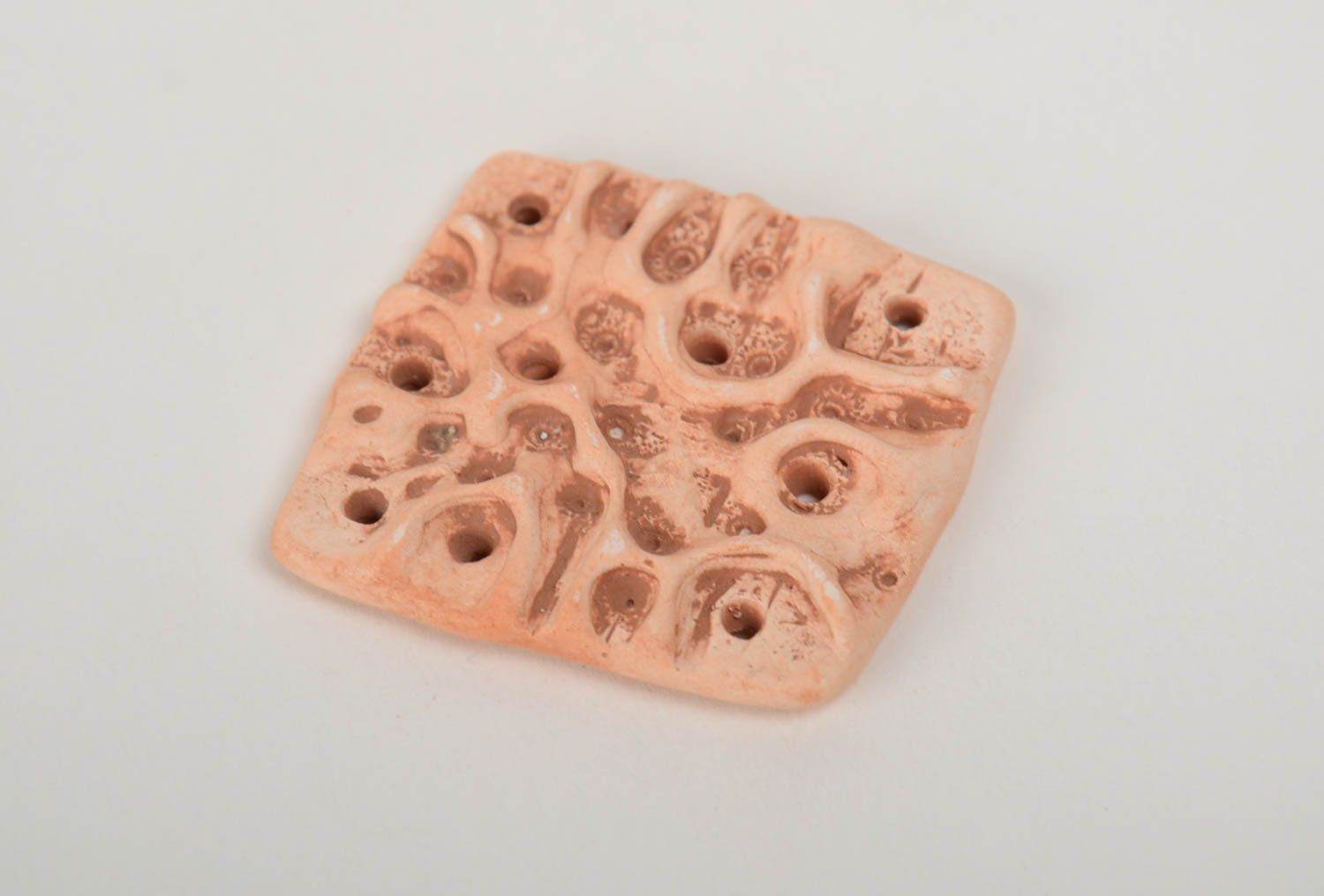 Handmade ceramic pendant of square shape molded of pottery clay with perforation photo 4