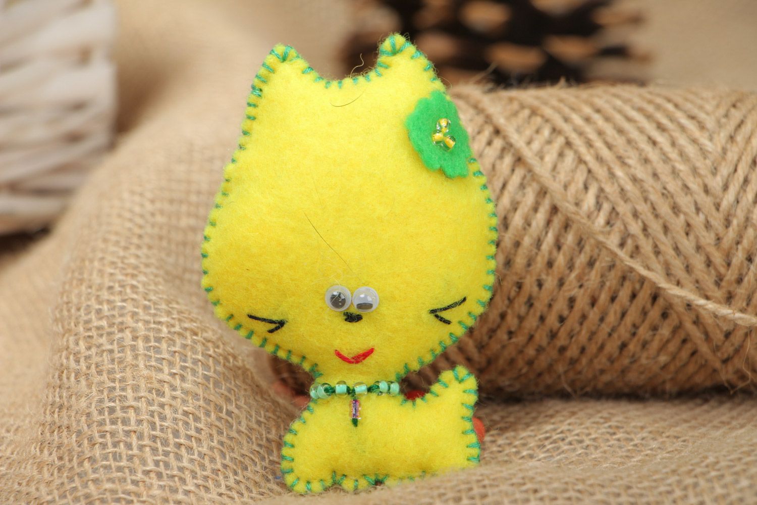 Handmade soft brooch sewn of yellow felt in the shape of kitten for children photo 1