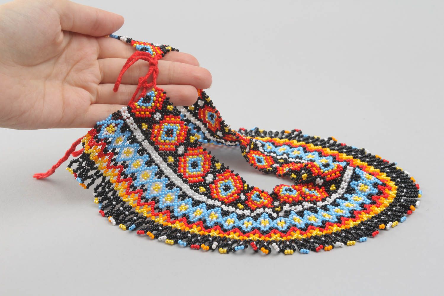 Broad beaded necklace with ornament photo 2