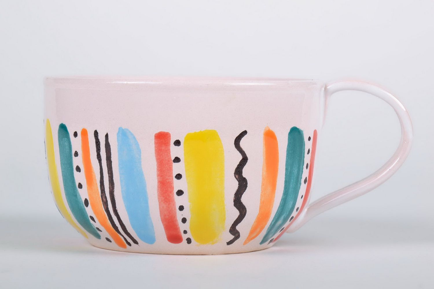 White glazed ceramic cup with handle in a color stripe pattern photo 3