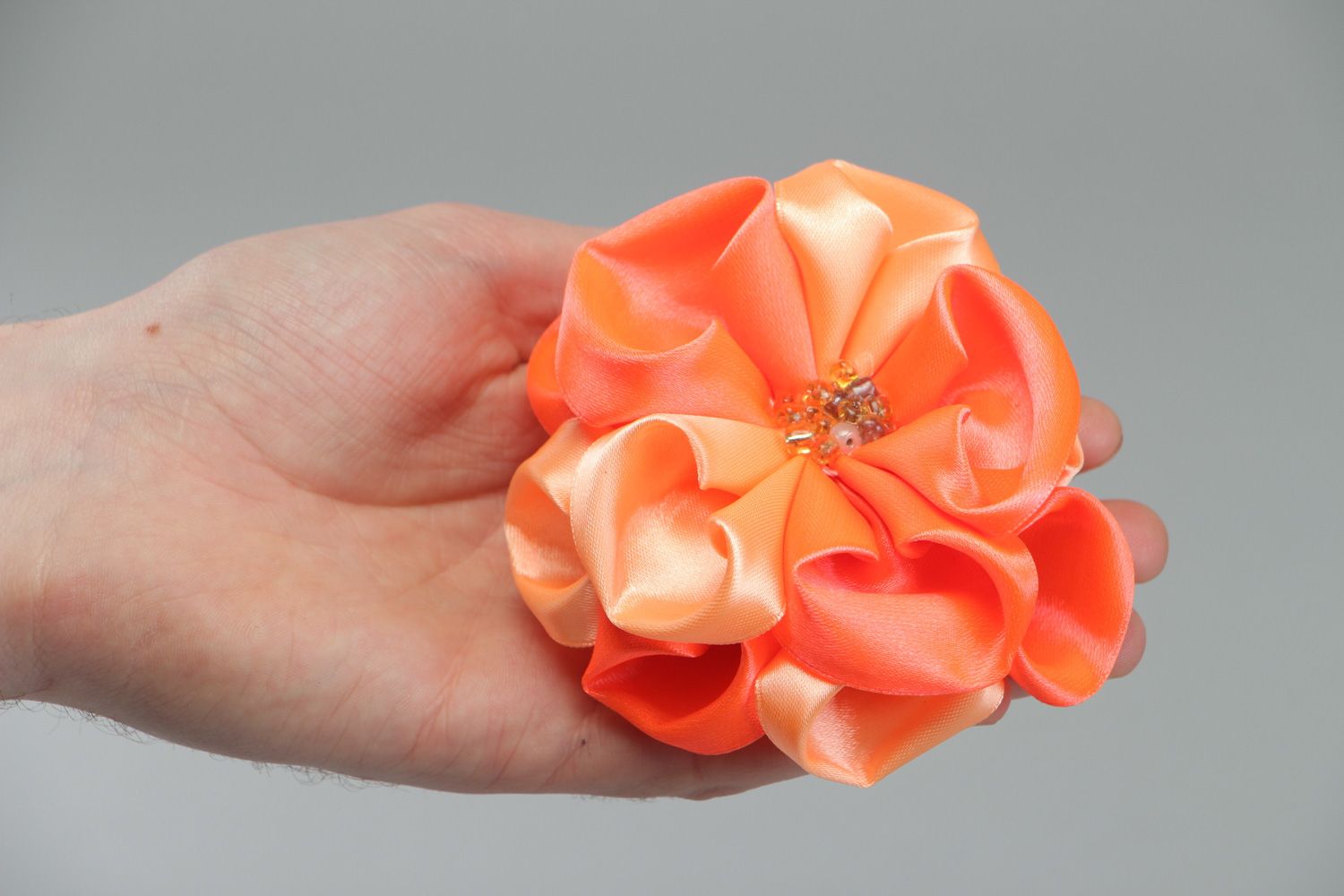 Handmade hair tie with volume flower of peach color sewn of satin fabric  photo 4