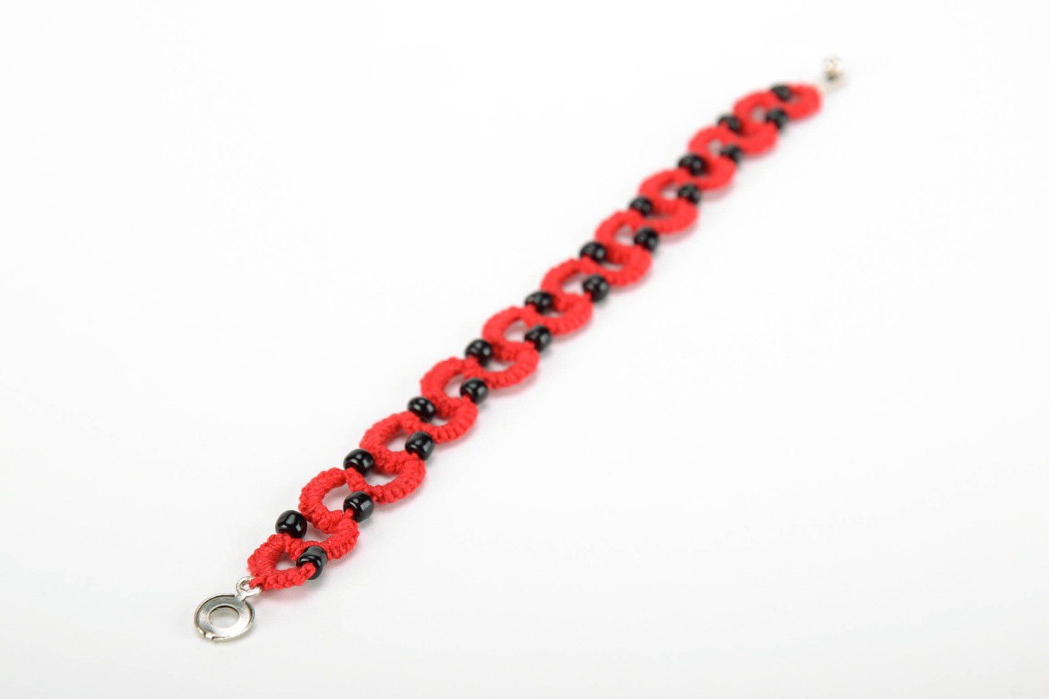 Red bracelet woven from cotton threads photo 2