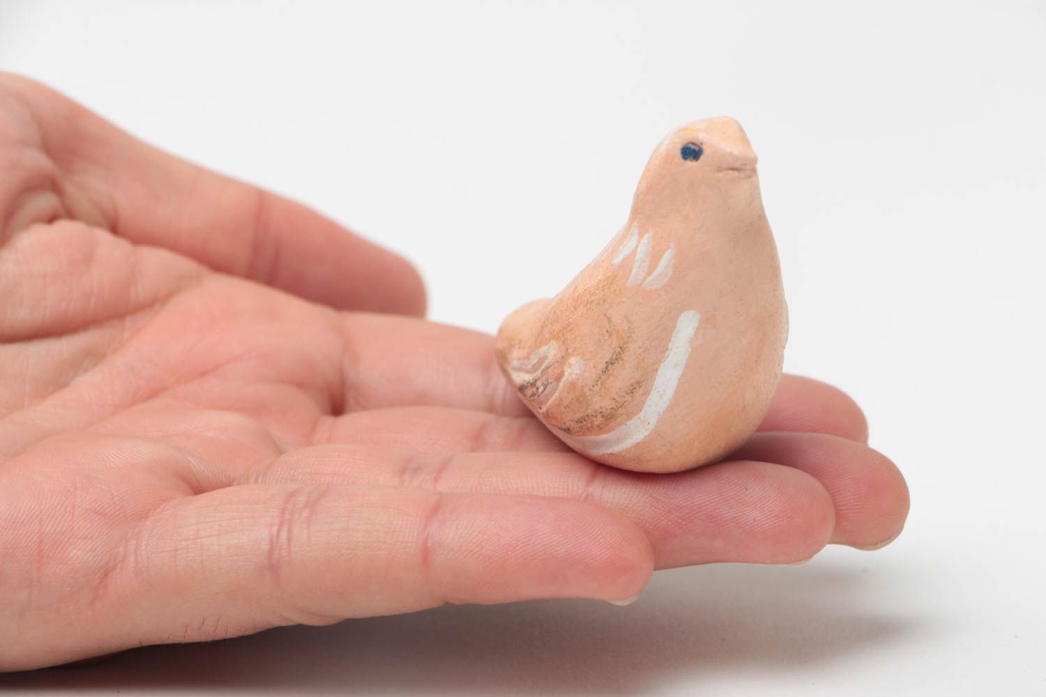 Small handmade toy made of clay in shape of whistle with painting for kids photo 5